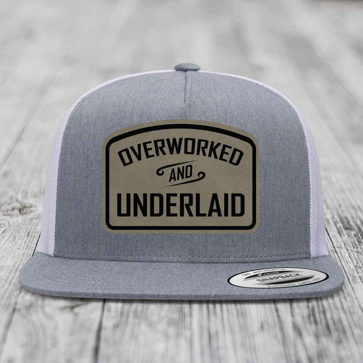 Overworked and Underlaid - Leather Patch Hat - Light Brown to Black Patch - Yupoong 6006 Snapback Flatbill Hat