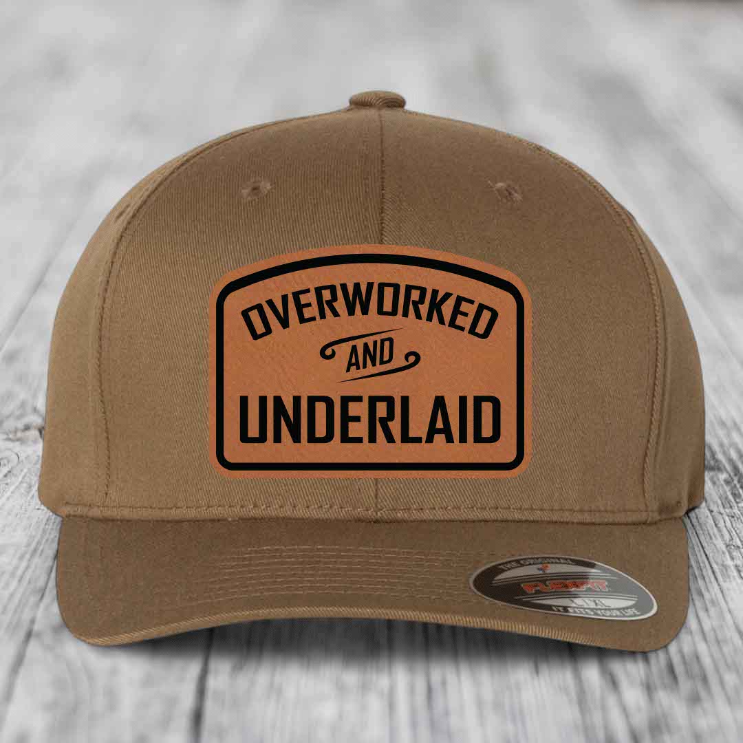 Overworked and Underlaid - Leather Patch Hat - Rawhide to Black Patch - Flexfit 6277 Fitted Hat