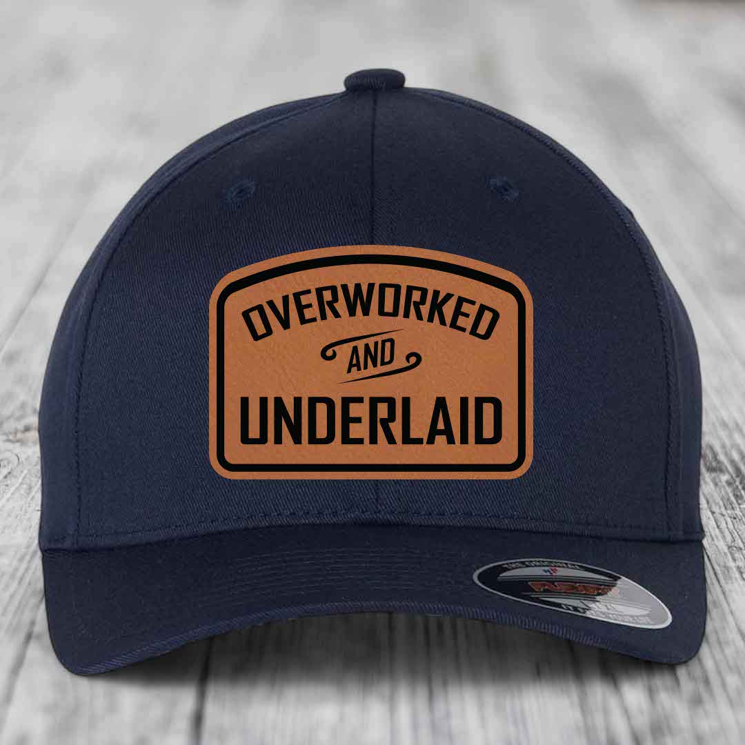 Overworked and Underlaid - Leather Patch Hat - Rawhide to Black Patch - Flexfit 6277 Fitted Hat