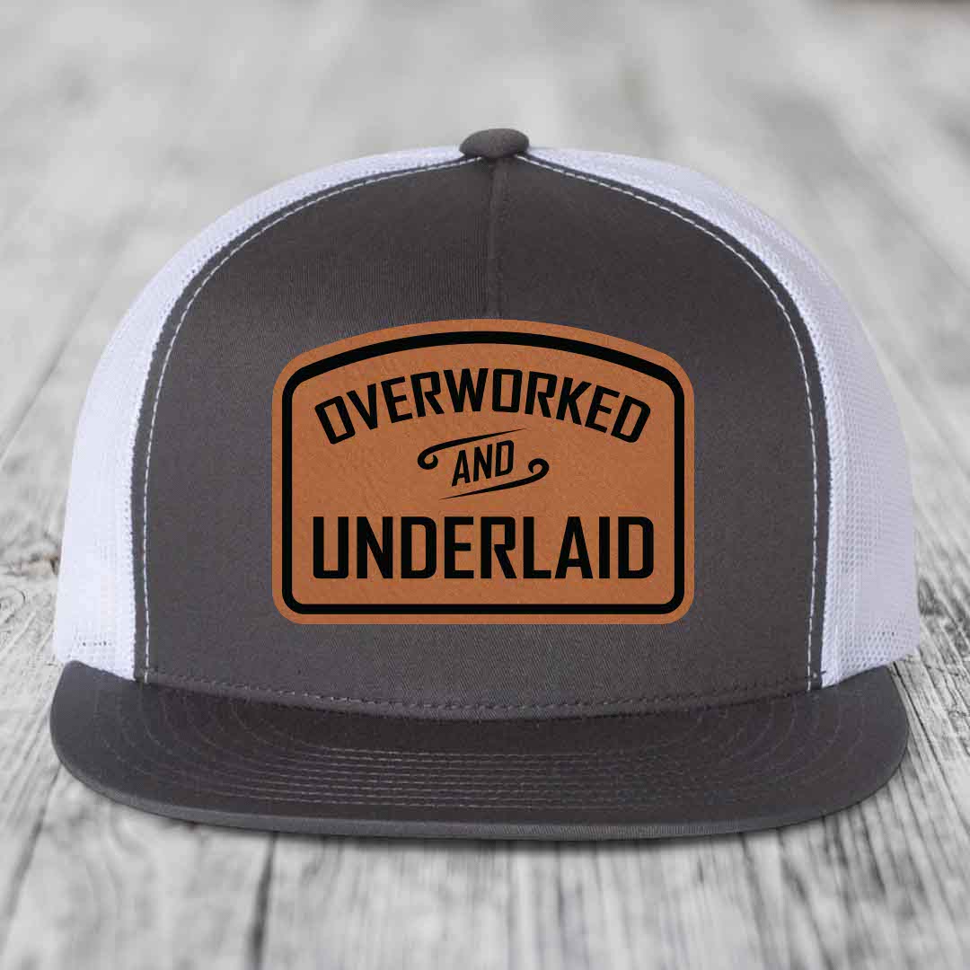 Overworked and Underlaid - Leather Patch Hat - Rawhide to Black Patch - Yupoong 6006 Snapback Flatbill Hat