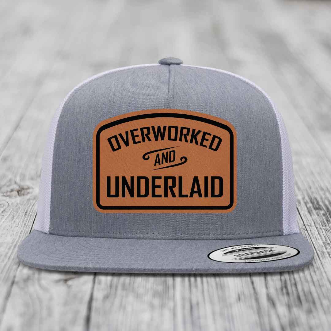Overworked and Underlaid - Leather Patch Hat - Rawhide to Black Patch - Yupoong 6006 Snapback Flatbill Hat