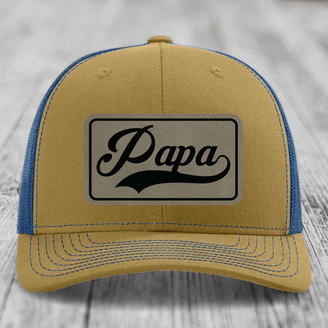 Tan and blue trucker hat with &