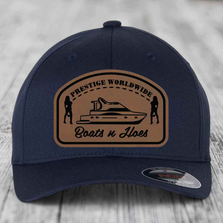 Prestige Worldwide, Boats and Hoes - Leather Patch Hat - Dark Brown to Black Patch - Flexfit 6277 Fitted Hat