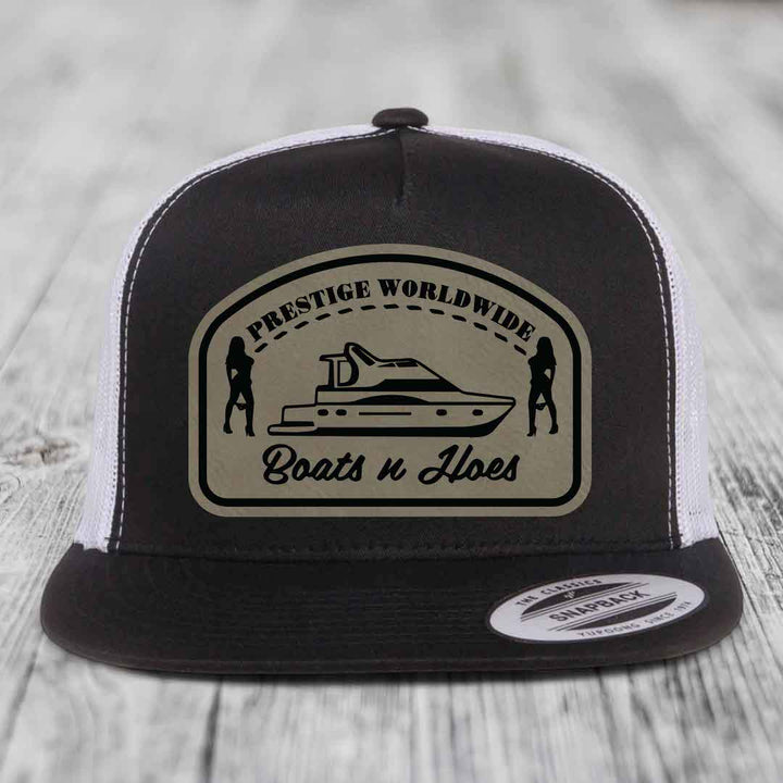Prestige Worldwide, Boats and Hoes - Leather Patch Hat - Light Brown to Black Patch - Yupoong 6006 Snapback Flatbill Hat