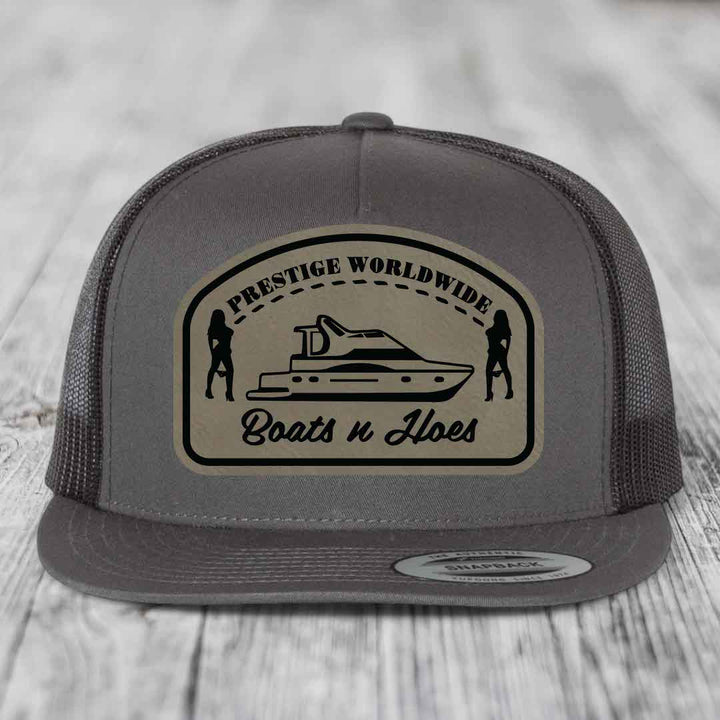 Prestige Worldwide, Boats and Hoes - Leather Patch Hat - Light Brown to Black Patch - Yupoong 6006 Snapback Flatbill Hat
