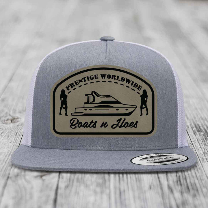Prestige Worldwide, Boats and Hoes - Leather Patch Hat - Light Brown to Black Patch - Yupoong 6006 Snapback Flatbill Hat