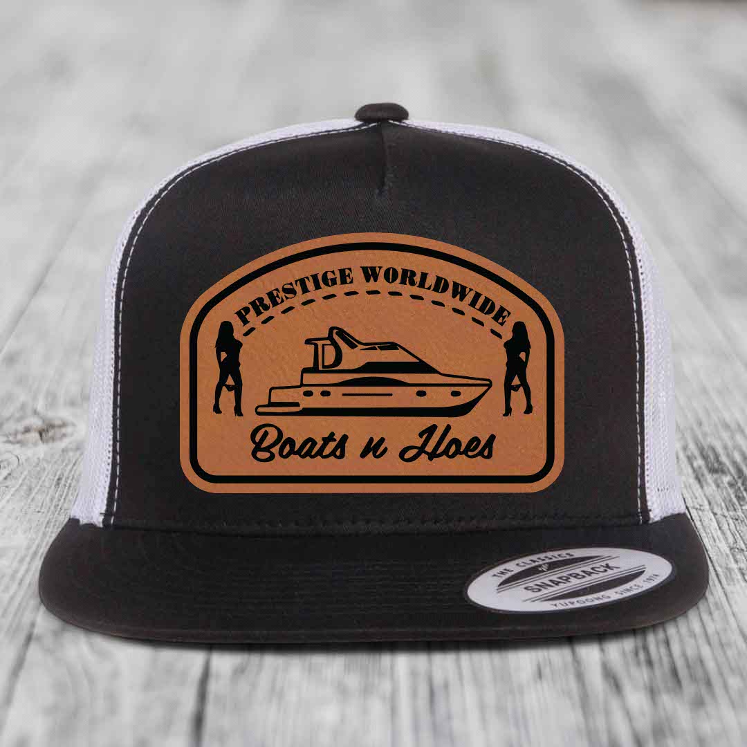 Prestige Worldwide, Boats and Hoes - Leather Patch Hat - Rawhide to Black Patch - Yupoong 6006 Snapback Flatbill Hat