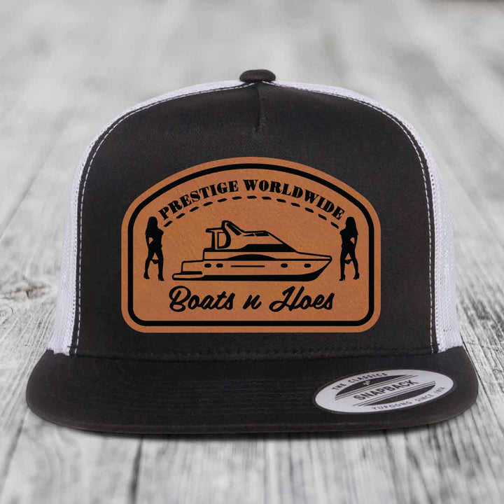 Prestige Worldwide, Boats and Hoes - Leather Patch Hat - Rawhide to Black Patch - Yupoong 6006 Snapback Flatbill Hat
