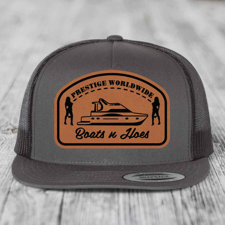 Prestige Worldwide, Boats and Hoes - Leather Patch Hat - Rawhide to Black Patch - Yupoong 6006 Snapback Flatbill Hat