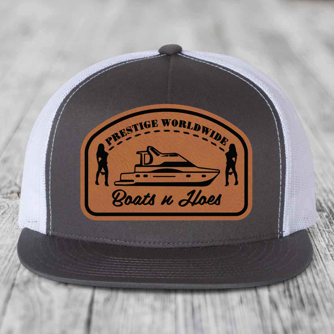 Prestige Worldwide, Boats and Hoes - Leather Patch Hat - Rawhide to Black Patch - Yupoong 6006 Snapback Flatbill Hat