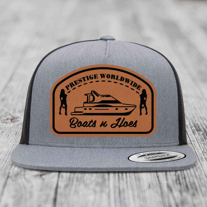 Prestige Worldwide, Boats and Hoes - Leather Patch Hat - Rawhide to Black Patch - Yupoong 6006 Snapback Flatbill Hat