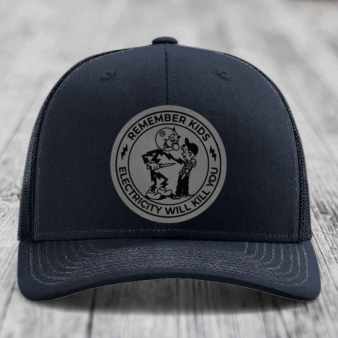 Dark blue trucker hat with a circular patch reading &
