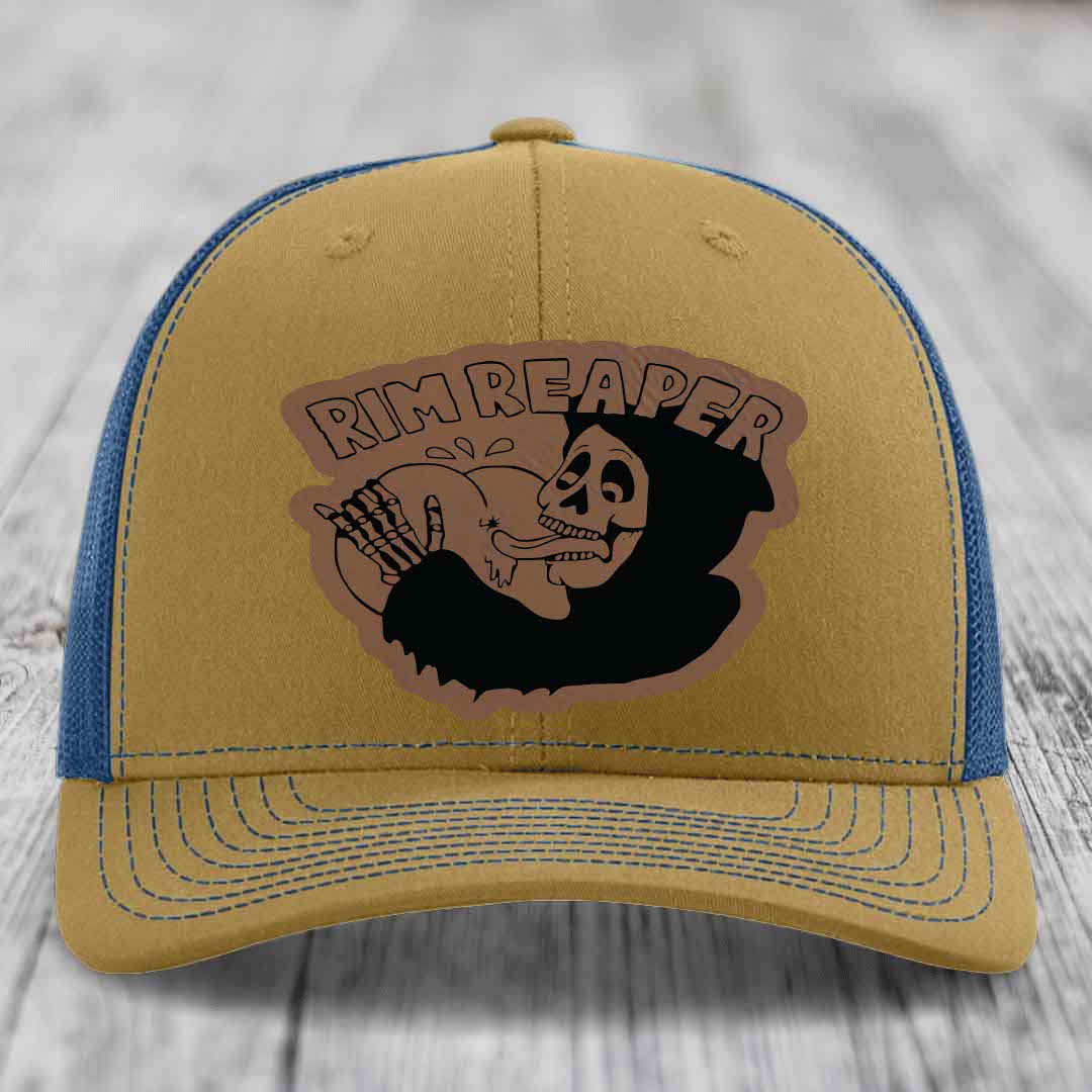 Tan trucker hat with blue mesh back and embroidered &