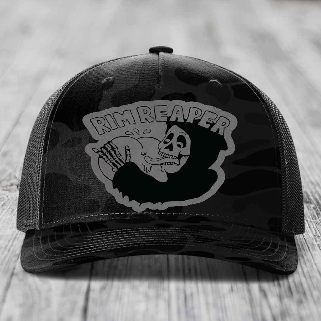 Black trucker hat with grey camo pattern and &