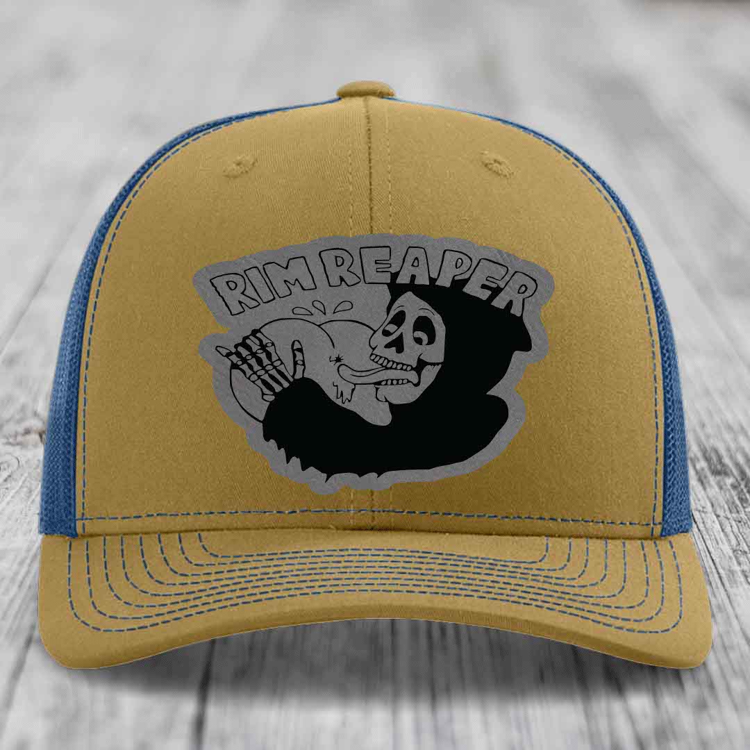 Tan and blue trucker hat with &