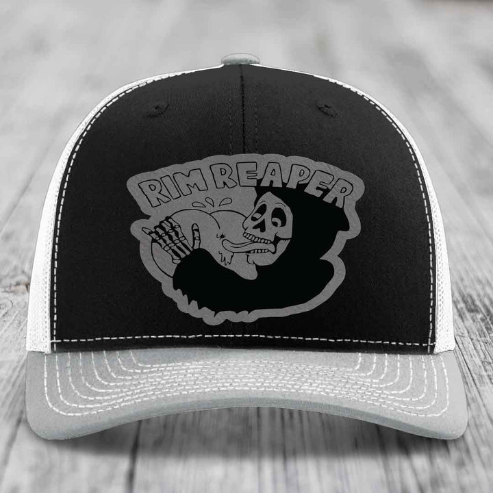 Black and grey trucker hat with &