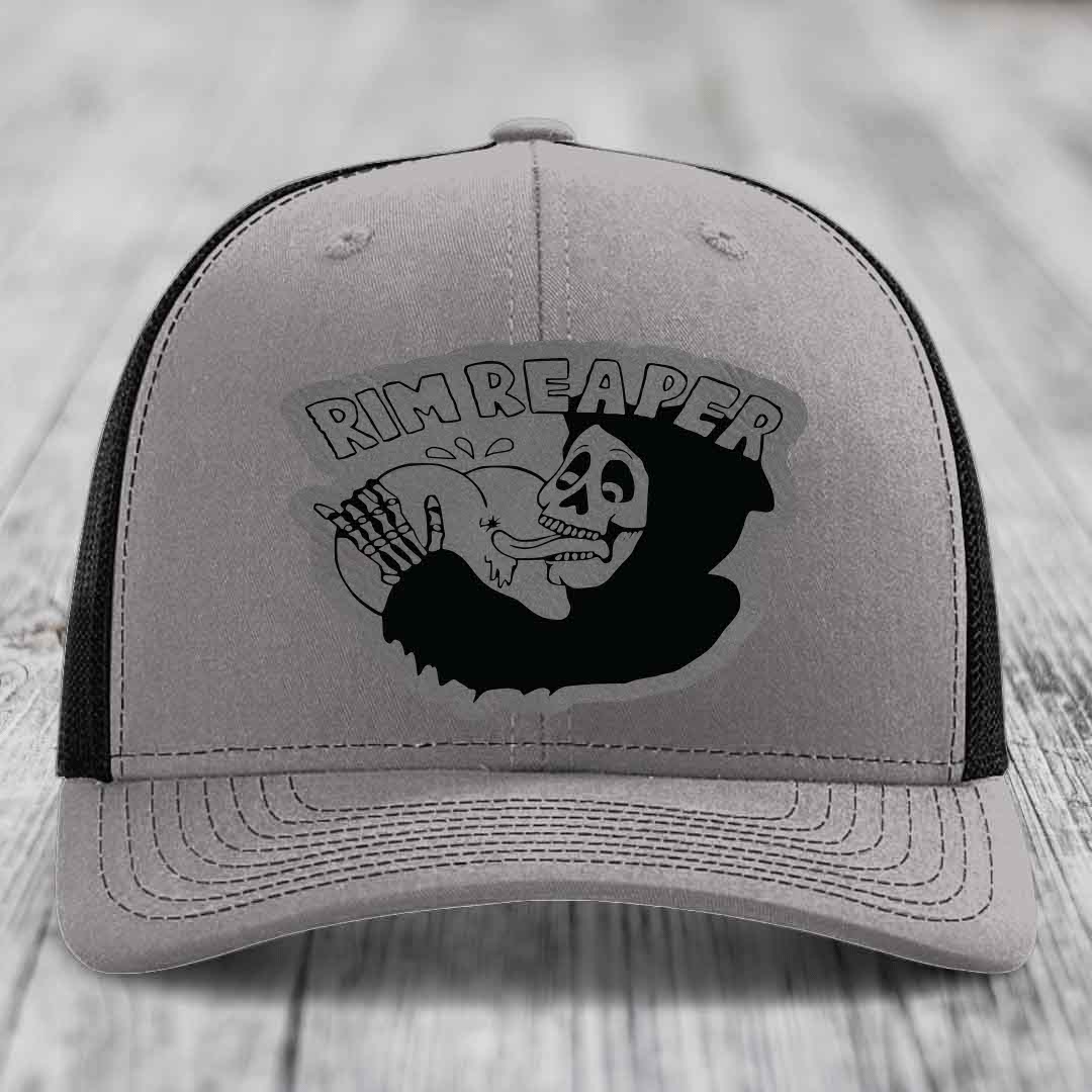 Grey trucker hat with black mesh back and embroidered &
