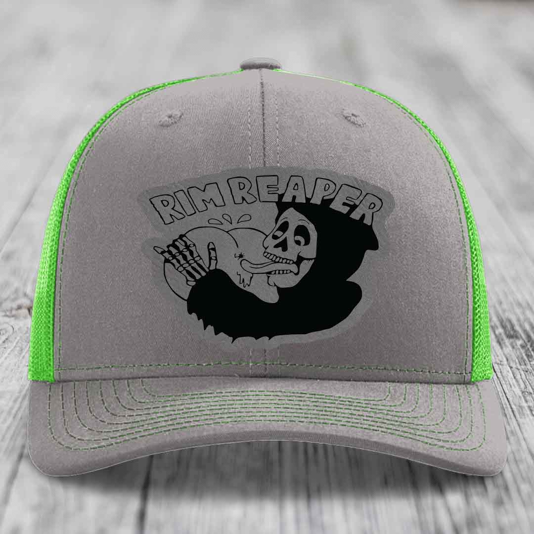Grey trucker hat with neon green mesh and stitching, featuring a black &