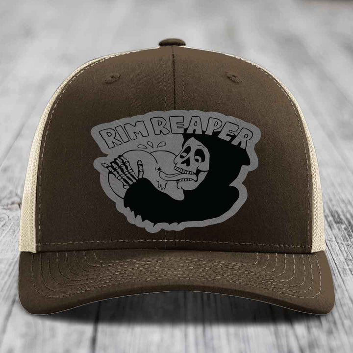 Brown trucker hat with grey embroidered &