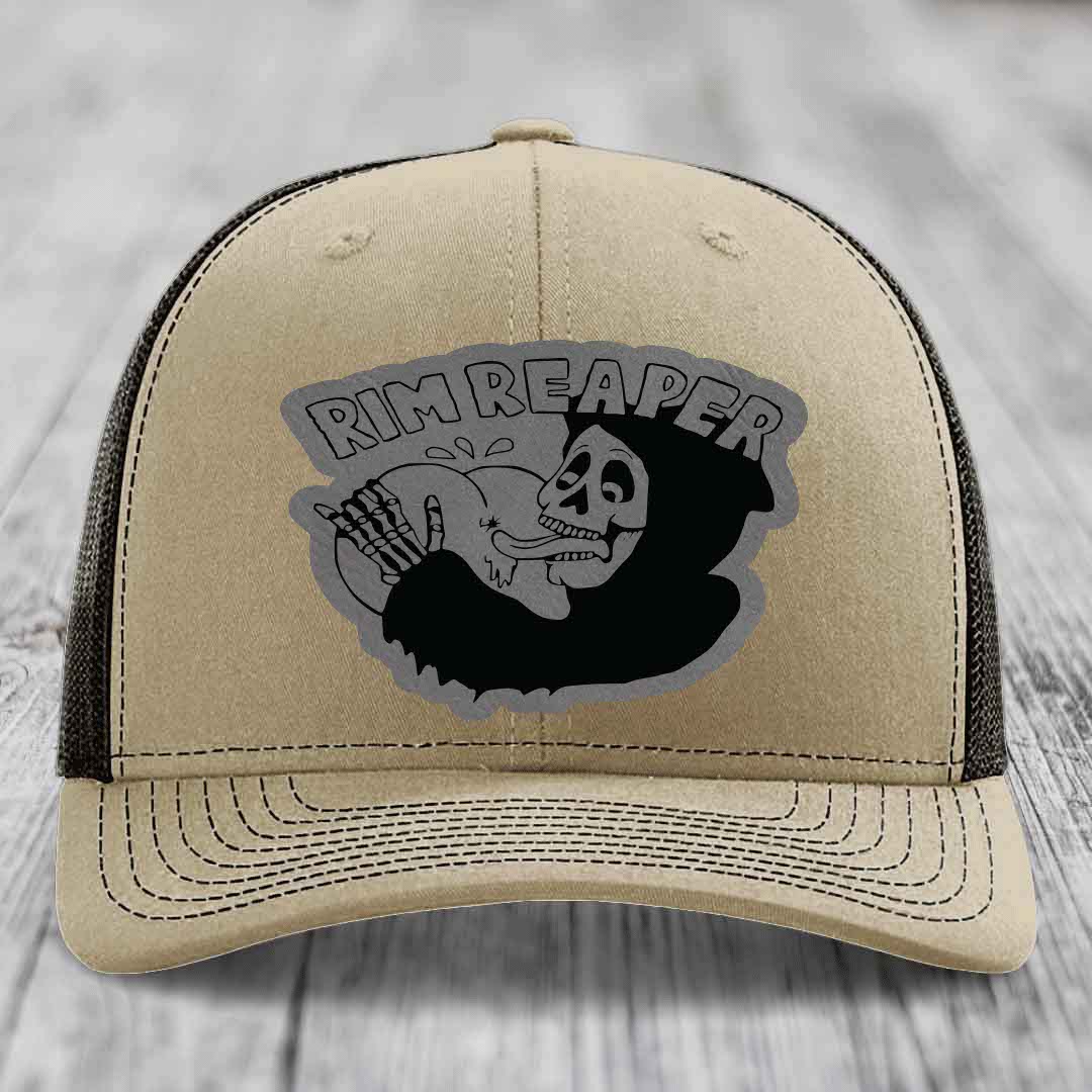 Beige trucker hat with black mesh back and gray &