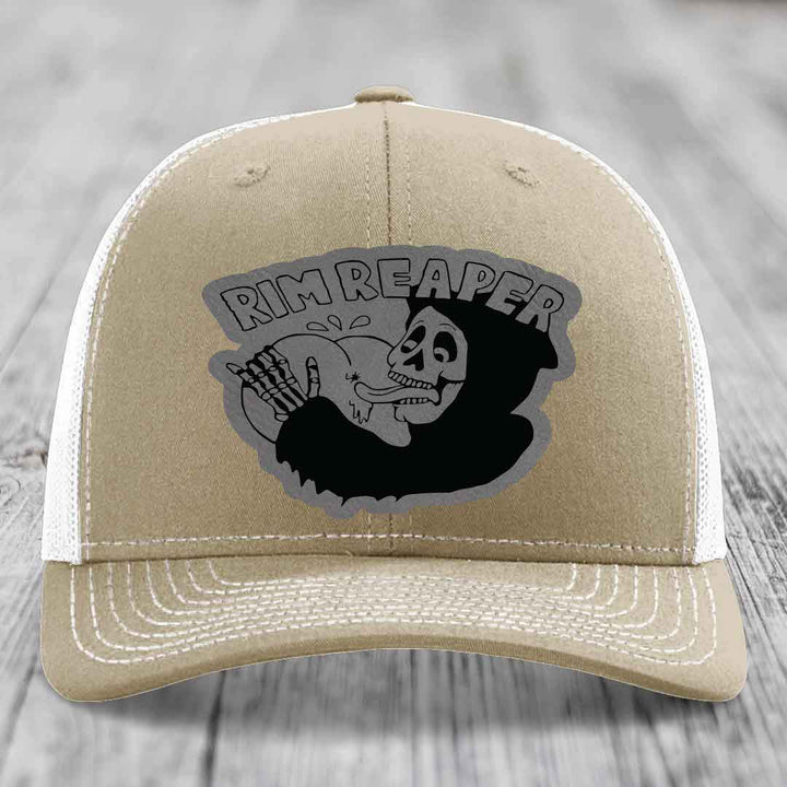 Tan trucker hat with black and grey &
