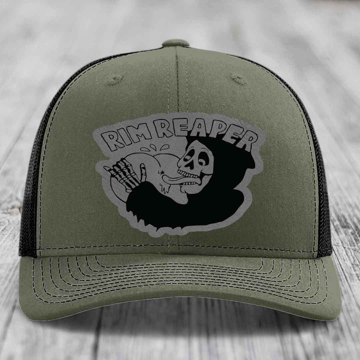 Olive green trucker hat with black mesh back and a grey &