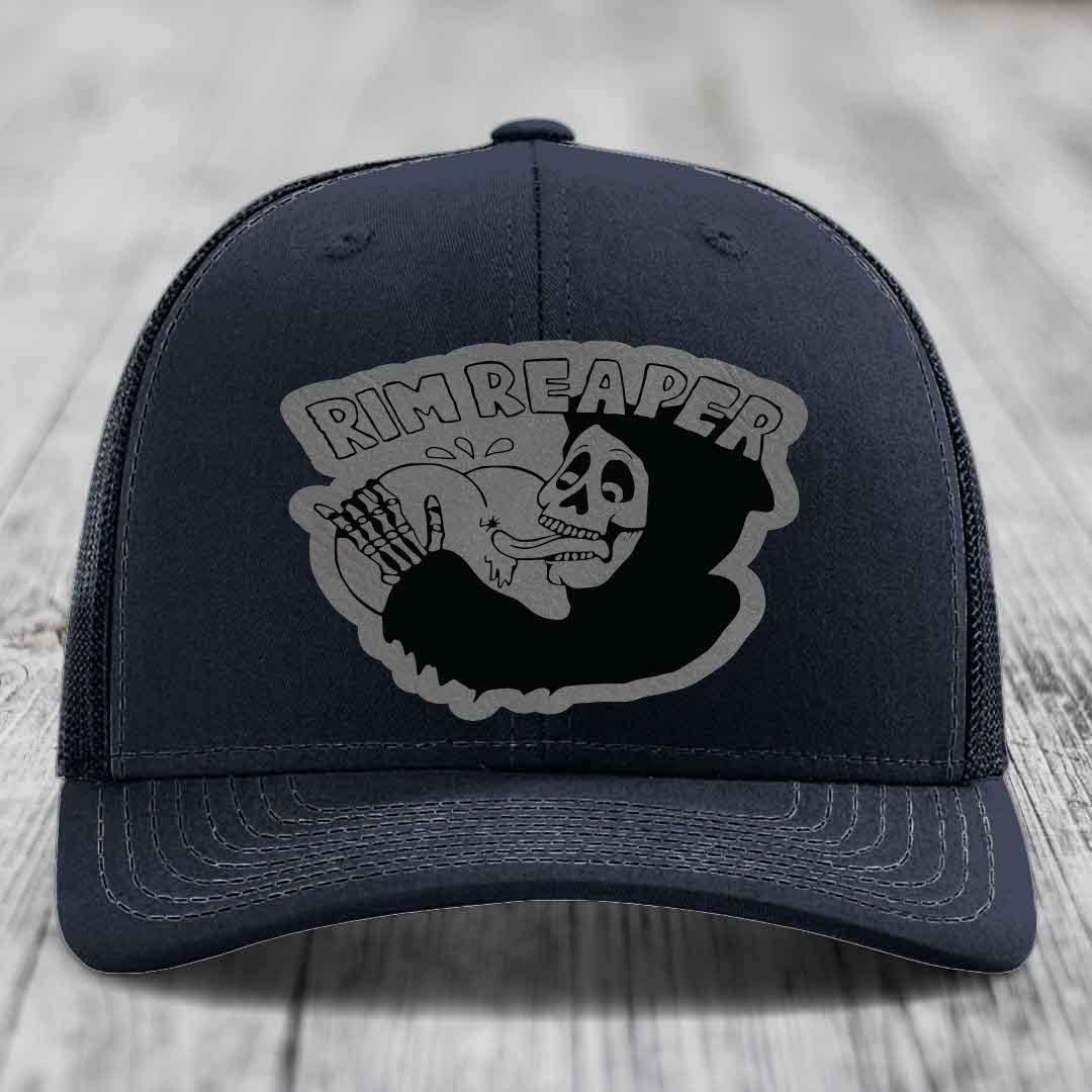 Dark blue trucker hat with grey embroidered &