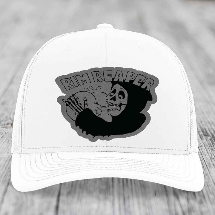 White trucker hat with black and grey &