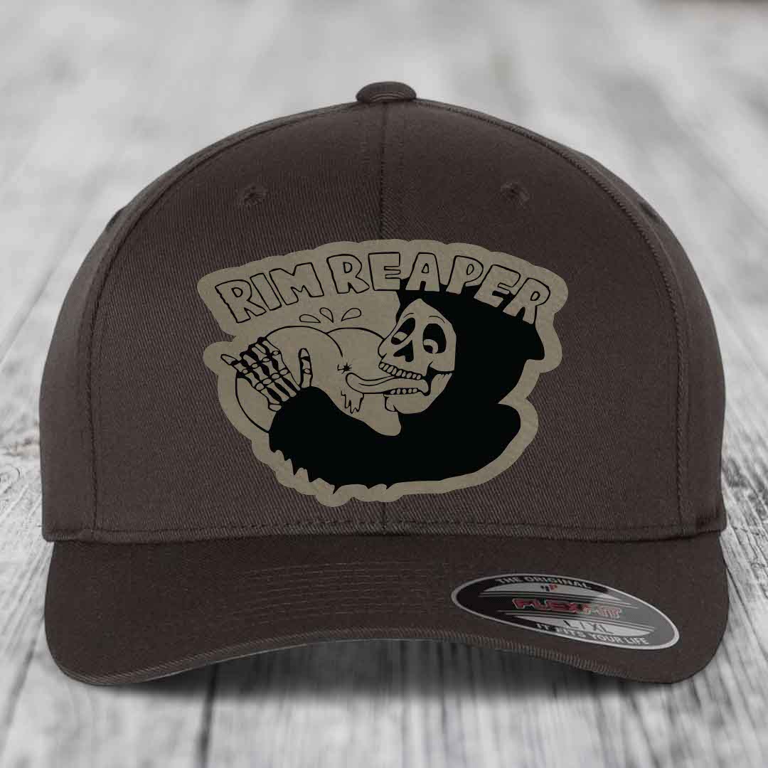 Dark brown Flexfit hat with a beige Rim Reaper skull patch on front.
