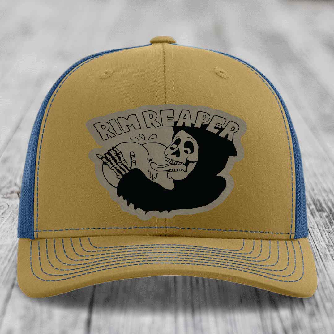 Tan and blue trucker hat with &