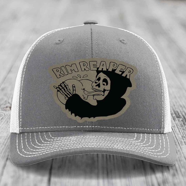 Grey trucker hat with white mesh back and embroidered &