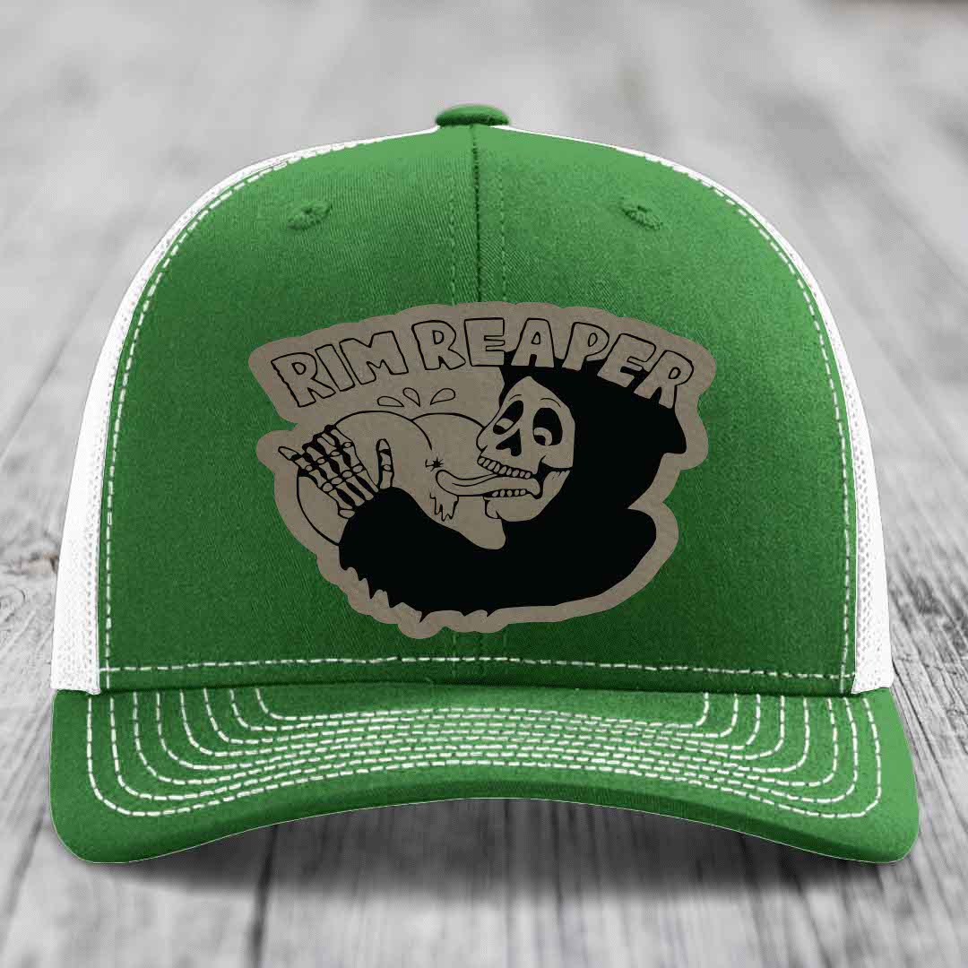 Green trucker hat with white mesh back and stitching, featuring a &