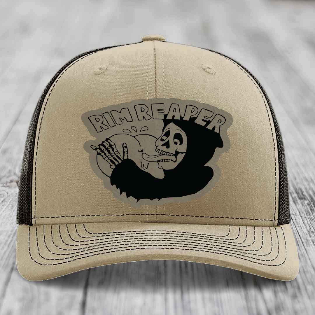 Beige trucker hat with black mesh back and embroidered &