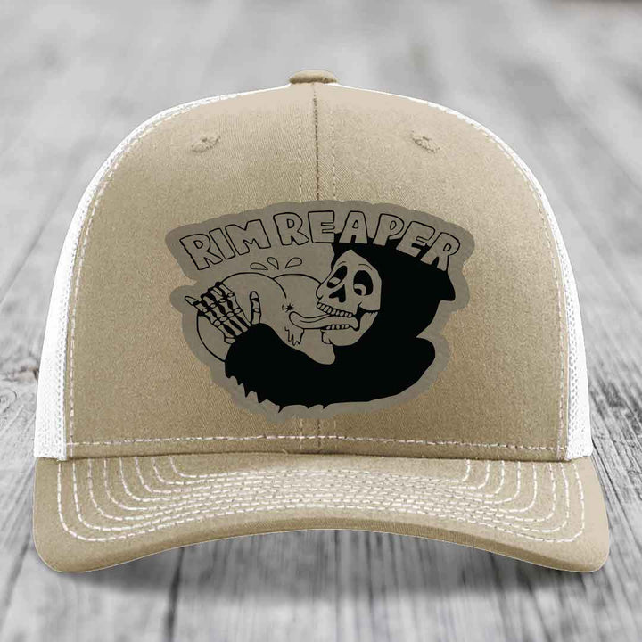Tan trucker hat with black &