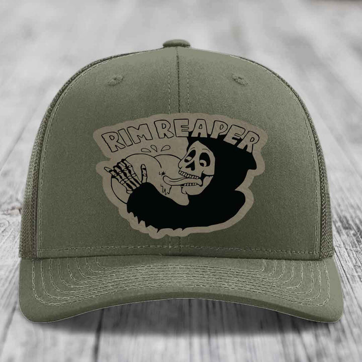 Olive green trucker hat with a black and beige &