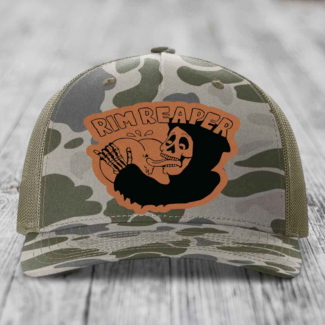 Camouflage trucker hat with orange &