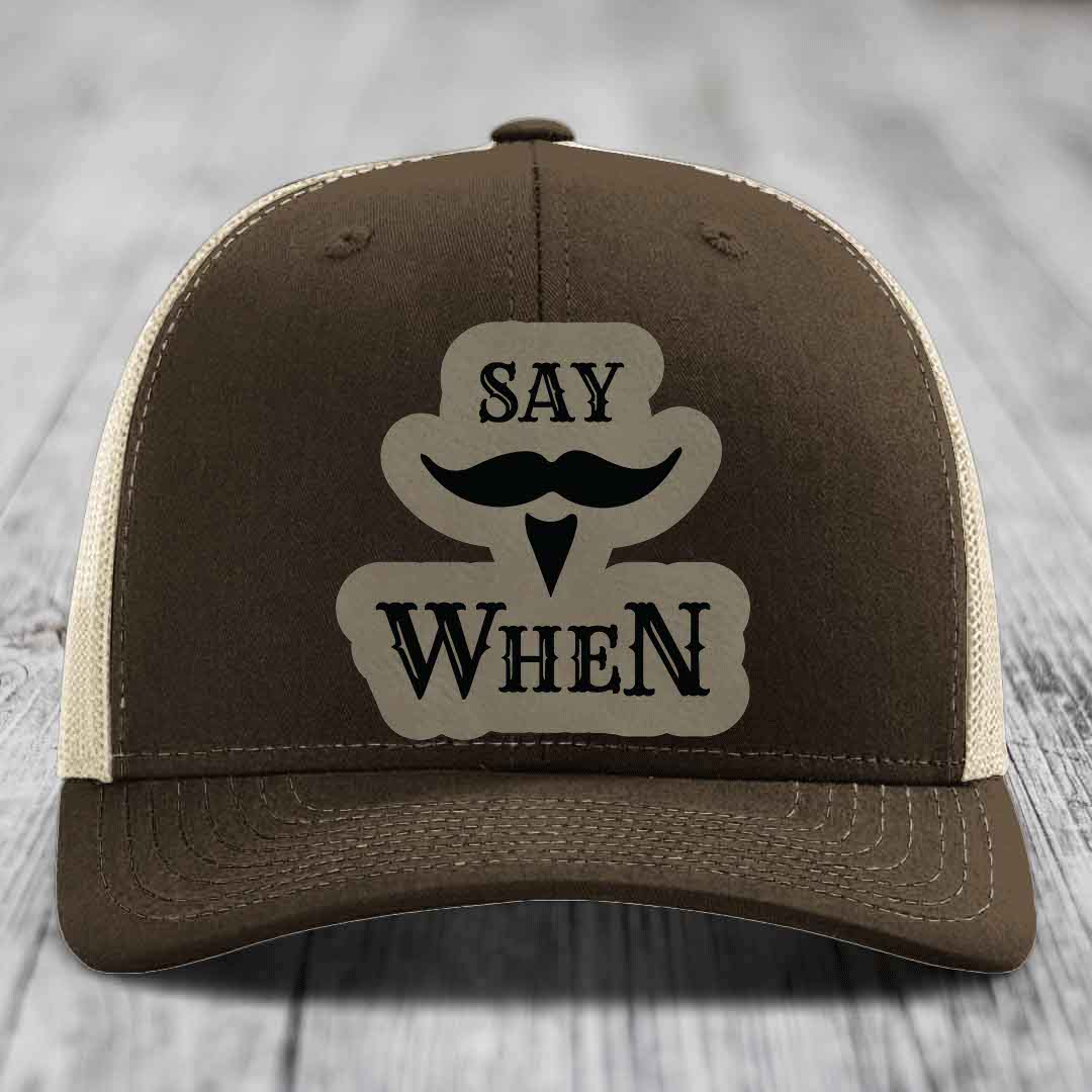 Brown trucker hat with beige mesh back and &