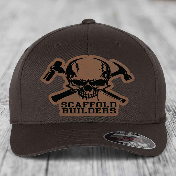 Dark brown Flexfit hat with skull and crossed hammers patch reading &