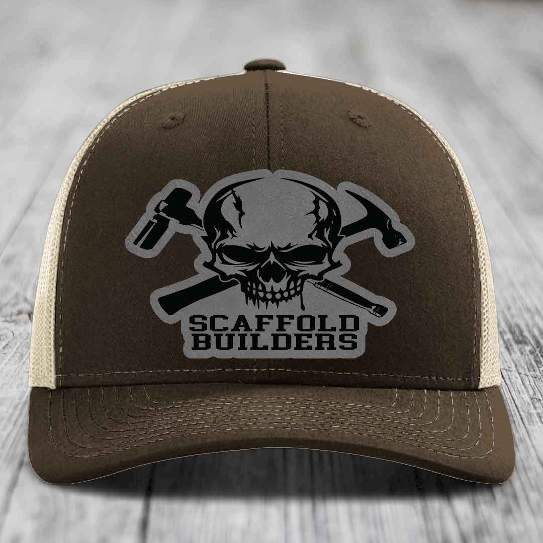 Brown trucker hat with skull and crossed hammers patch, reading &