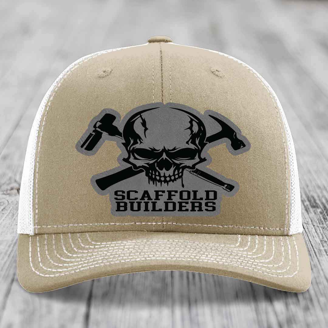 Tan trucker hat with skull and crossed hammers patch, reading &