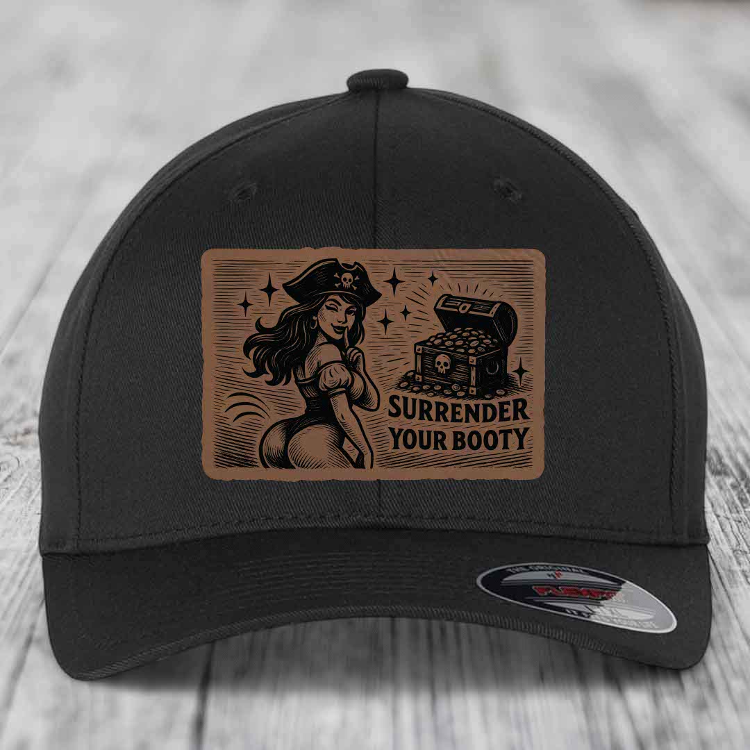 Black baseball cap with brown leather patch featuring pirate woman and treasure chest, text reads &