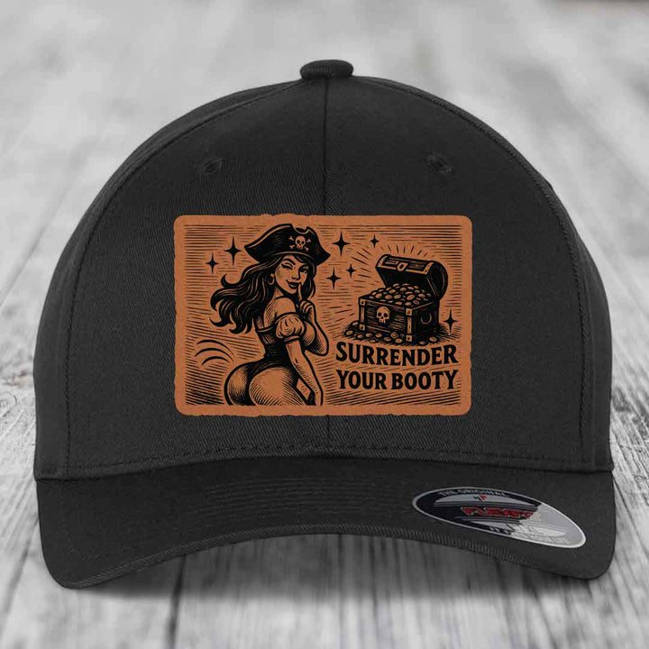 Black baseball cap with brown leather patch featuring pirate woman and treasure chest, text reads &