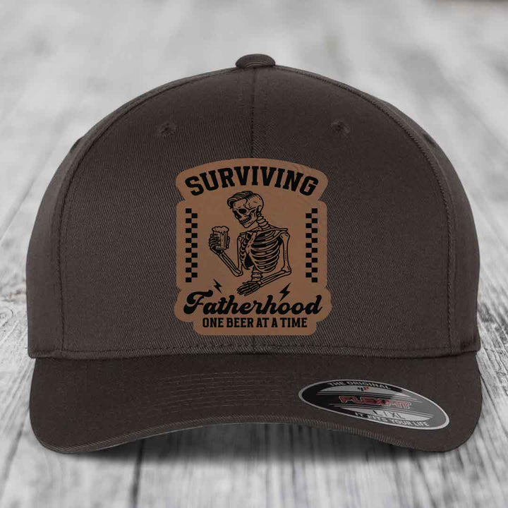 Surviving Fatherhood, One Beer At A Time - Leather Patch Hat - Dark Brown to Black Patch - Flexfit 6277 Fitted Hat