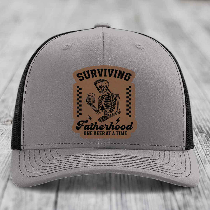 Surviving Fatherhood, One Beer At A Time - Leather Patch Hat - Dark Brown to Black Patch - Richardson 112 Snapback Trucker Hat