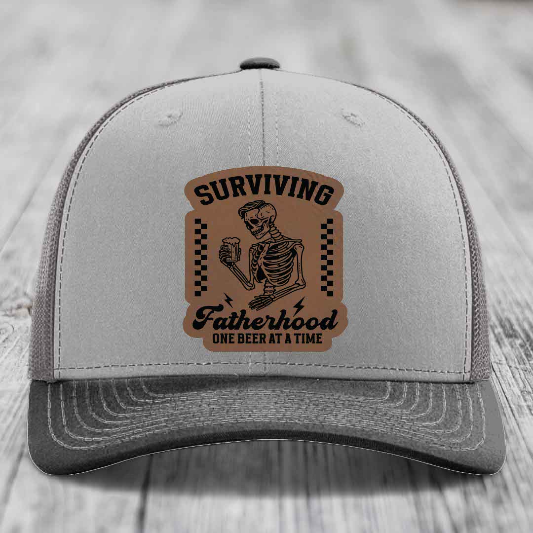 Surviving Fatherhood, One Beer At A Time - Leather Patch Hat - Dark Brown to Black Patch - Richardson 112 Snapback Trucker Hat