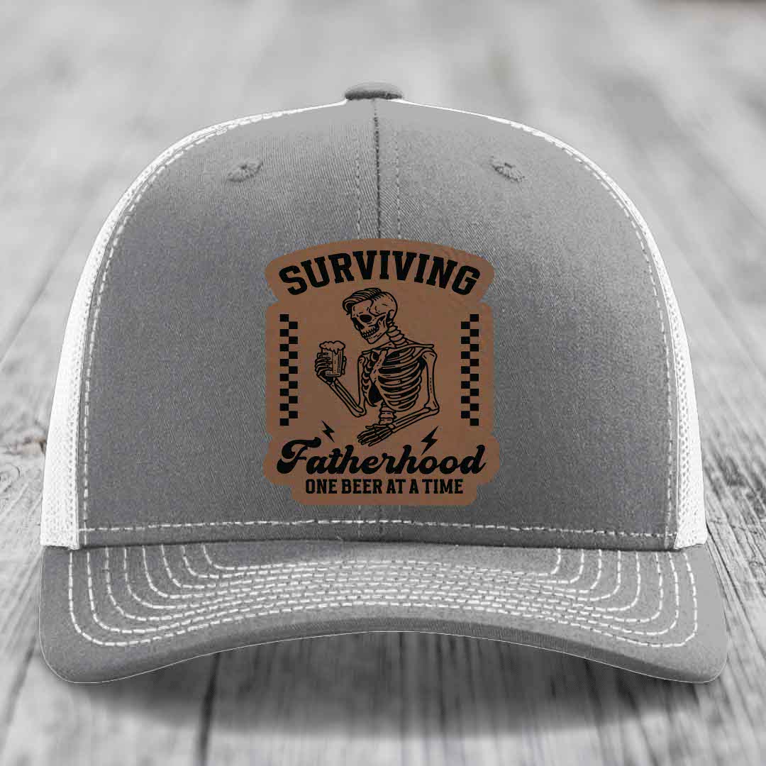 Surviving Fatherhood, One Beer At A Time - Leather Patch Hat - Dark Brown to Black Patch - Richardson 112 Snapback Trucker Hat