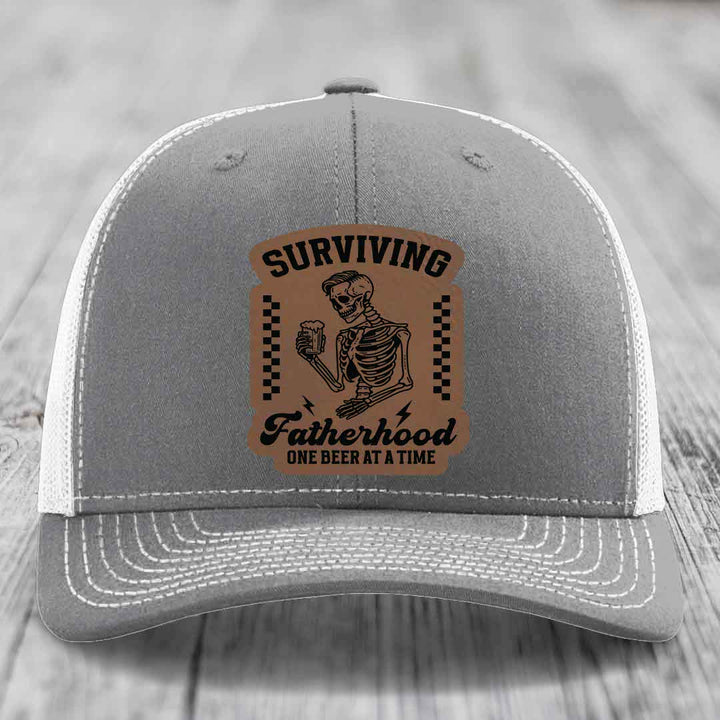 Surviving Fatherhood, One Beer At A Time - Leather Patch Hat - Dark Brown to Black Patch - Richardson 112 Snapback Trucker Hat
