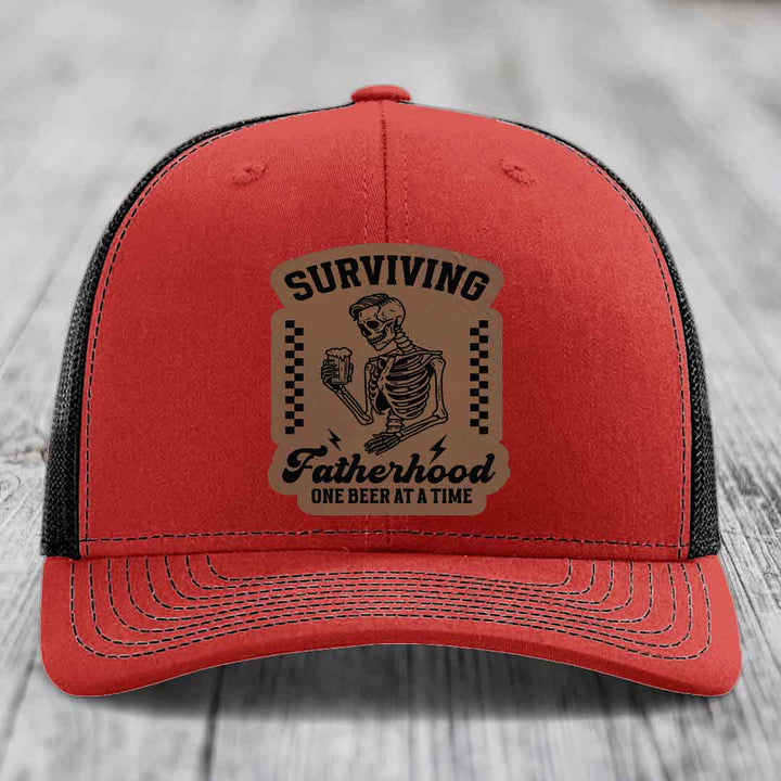 Surviving Fatherhood, One Beer At A Time - Leather Patch Hat - Dark Brown to Black Patch - Richardson 112 Snapback Trucker Hat