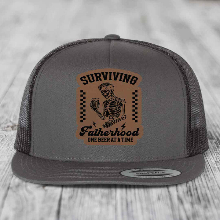 Surviving Fatherhood, One Beer At A Time - Leather Patch Hat - Dark Brown to Black Patch - Yupoong 6006 Snapback Flatbill Hat