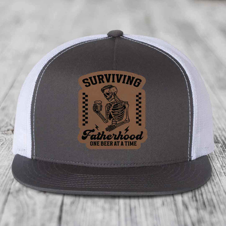 Surviving Fatherhood, One Beer At A Time - Leather Patch Hat - Dark Brown to Black Patch - Yupoong 6006 Snapback Flatbill Hat